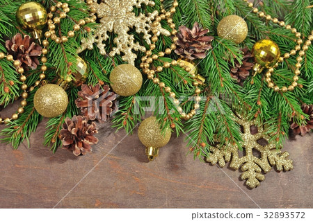 Golden Christmas decorations and spruce branch 32893572