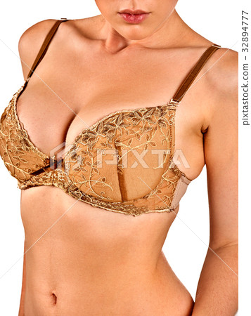 Breast self exam of women. Woman wearing bra. 32894777
