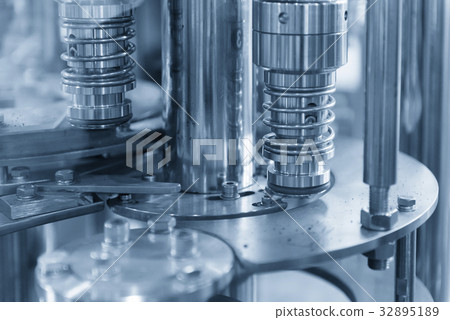 The bottle filling production machine. 32895189