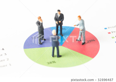 Miniature model of businessman standing on chart Miniature model of businessman standing on chart 32896487