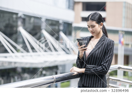 Business people looking to smartphone. Business people looking to smartphone. 32896496