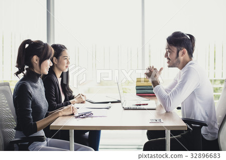 Young Buiness people having job interview. 32896683