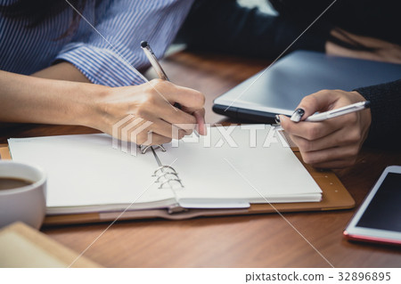 Closeup woman hand writing on the book 32896895