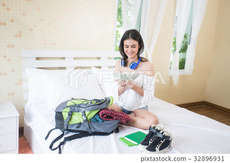 Beautiful young woman holding a lot of money Beautiful young woman holding a lot of money 32896931
