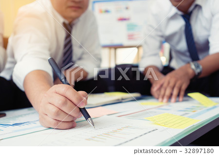 business partners discussing documents and ideas business partners discussing documents and ideas 32897180