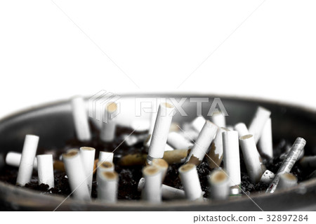Ashtray closeup full of smoked cigarettes stub Ashtray closeup full of smoked cigarettes stub 32897284