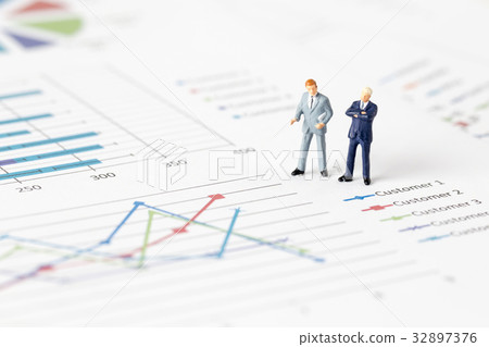 Miniature model group of businessman on graph Miniature model group of businessman on graph 32897376