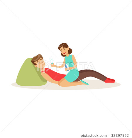 Woman providing first aid to a lying unconscious Woman providing first aid to a lying unconscious 32897532