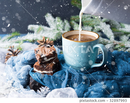 Cream cheese brownies and coffee with milk. Snow 32897993
