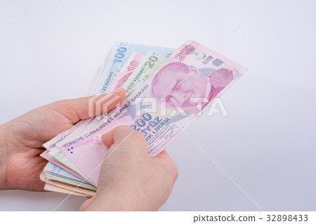 Hand holding Turksh Lira banknotes  in hand 32898433