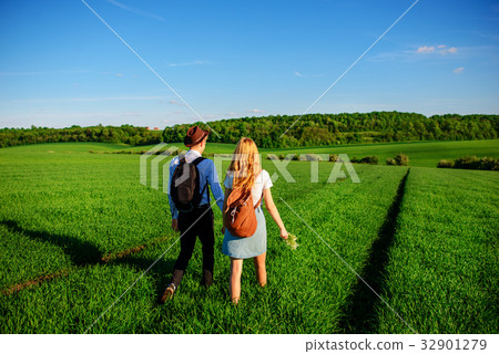 With a backpack, a man in a hat and a woman With a backpack, a man in a hat and a woman 32901279