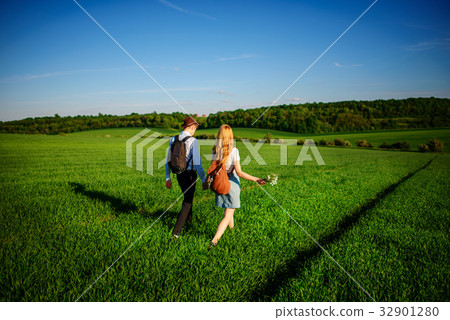 With a backpack, a man in a hat and a woman With a backpack, a man in a hat and a woman 32901280