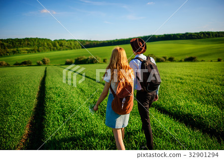 With a backpack, a man in a hat and a woman With a backpack, a man in a hat and a woman 32901294