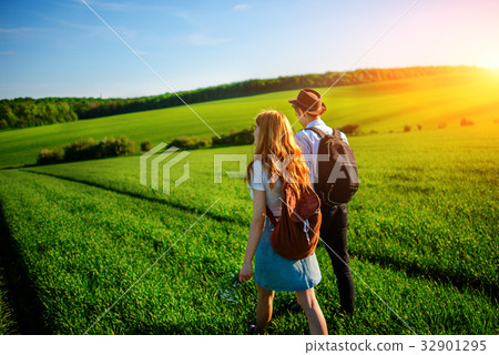 With a backpack, a man in a hat and a woman With a backpack, a man in a hat and a woman 32901295