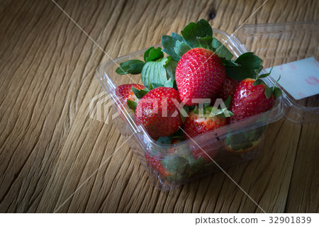 Red ripe strawberries in plastic packaging Red ripe strawberries in plastic packaging 32901839