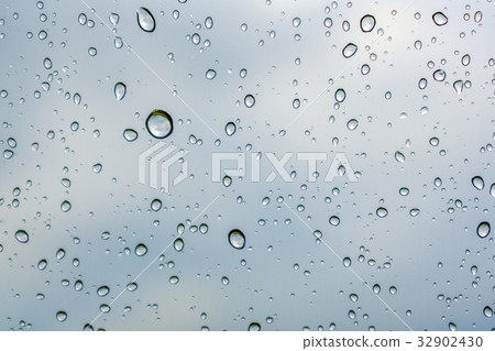 Rain drops on the windshield 32902430