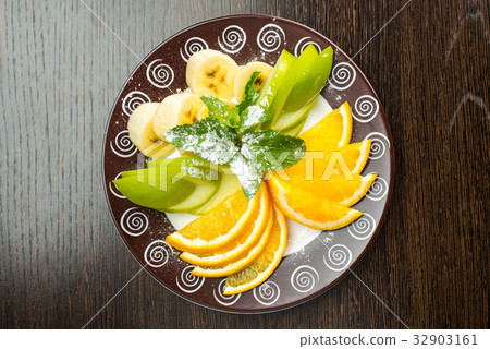 Vegan breakfast: variety of fruits, nuts and 32903161