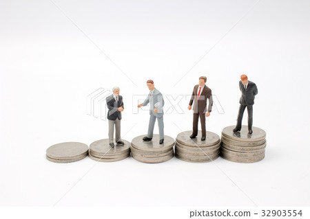 Business man shaking  on coins stacks 32903554