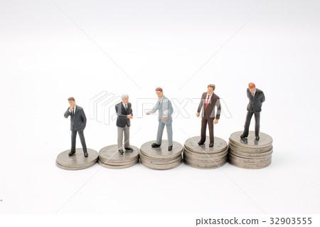 Business man shaking on coins stacks Business man shaking on coins stacks 32903555