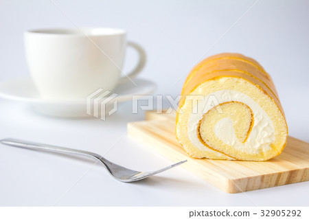 Swiss roll and coffee on white background. Swiss roll and coffee on white background. 32905292
