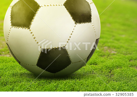 Soccer Ball on green soccer field 32905385