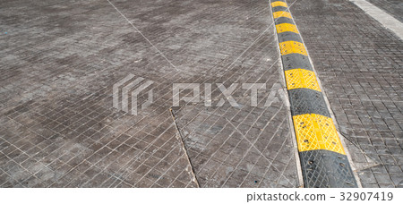 Road bump on the road for reduce speed. Road bump on the road for reduce speed. 32907419