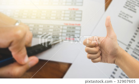 Good hand on blur background of  pen at red total  32907605