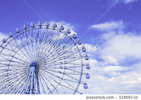 Blue ferris wheel with blue sky Blue ferris wheel with blue sky 32909110
