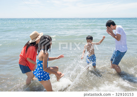 Family playing in the sea Family playing in the sea 32910153