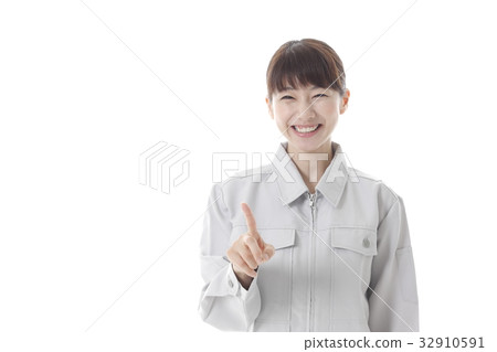 A woman with a pointing pose A woman with a pointing pose 32910591