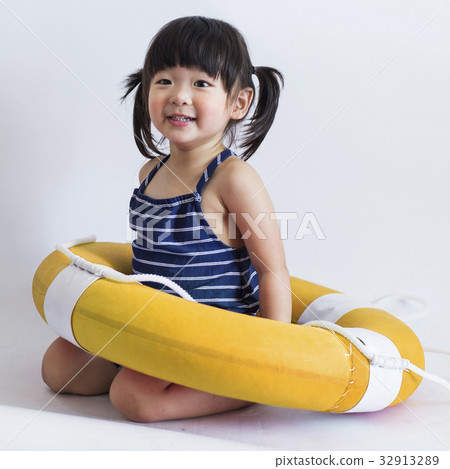 Cute and innocent japanese kid with life ring 32913289