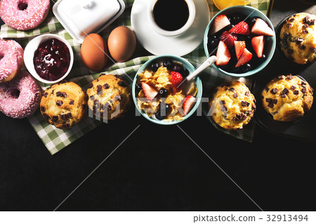 Tasty fresh breakfast food ingredients on black Tasty fresh breakfast food ingredients on black 32913494