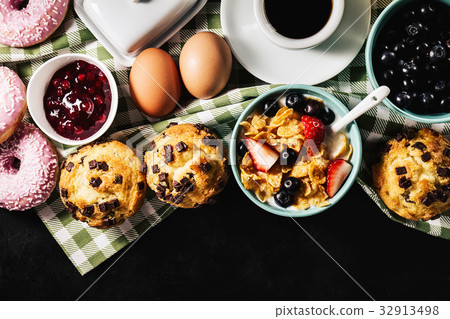 Tasty fresh breakfast food ingredients on black Tasty fresh breakfast food ingredients on black 32913498