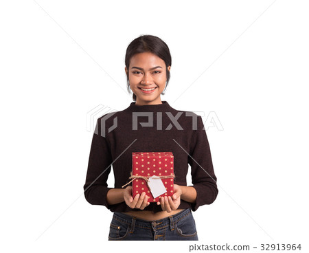 Beautiful asian woman holds a gift on white  32913964
