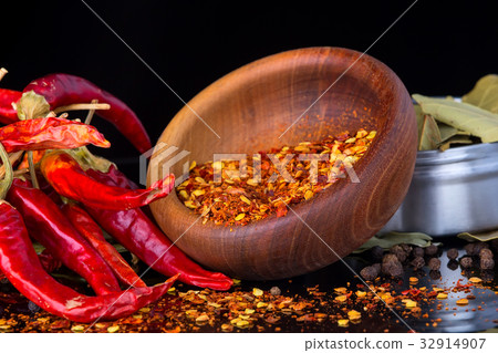 Chili peppers on a black background Chili peppers on a black background 32914907