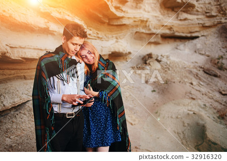 Beautiful woman and handsome man wrapped  32916320