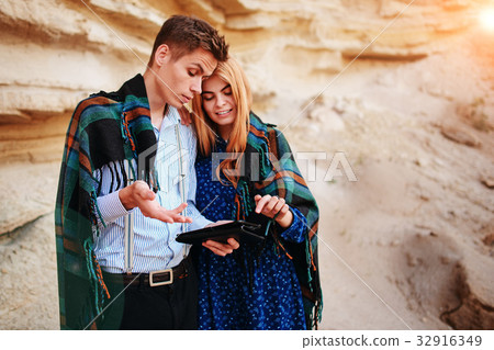 Beautiful woman and handsome man wrapped  32916349