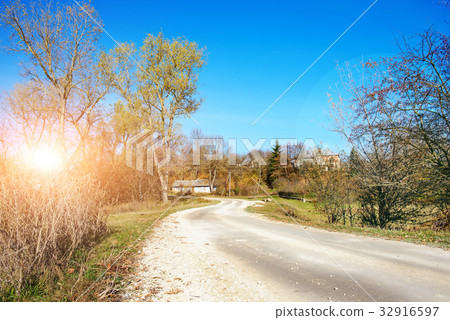 An autumn winding rural country road  32916597