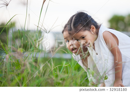 Two asian girl having fun and playing with nature 32918180