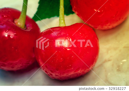 Bright red delicious ripe cherries Bright red delicious ripe cherries 32918227