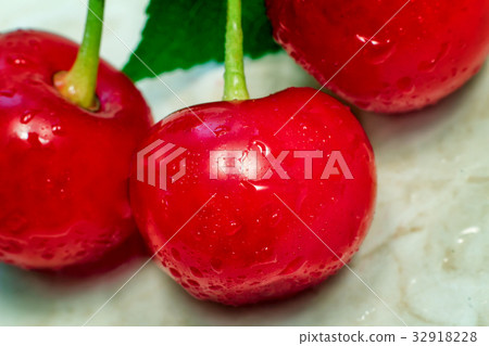 Bright red delicious ripe cherries Bright red delicious ripe cherries 32918228