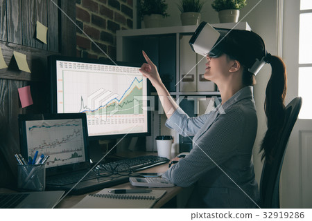 glasses lady in suit sitting computer 32919286