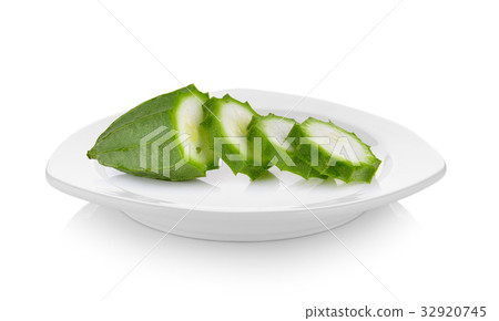 Fresh Angled luffa fruit in ceramic white plate 32920745