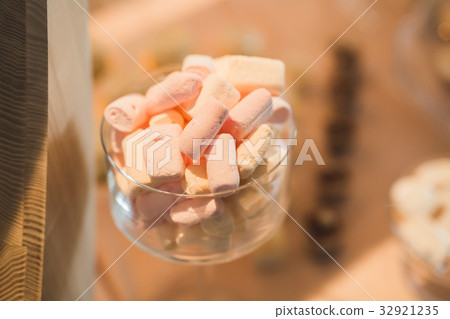 Different kinds of baked sweets on a buffet Different kinds of baked sweets on a buffet 32921235