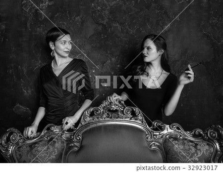 Two girls look at each other. Haughty eyes. Two girls look at each other. Haughty eyes. 32923017