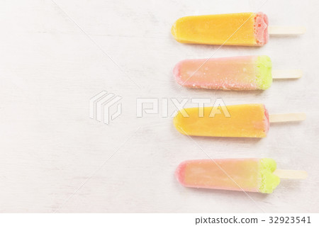 Multi-colored popsicles on a white background 32923541
