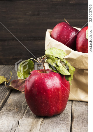 Apples in paper package on a dark background 32923766