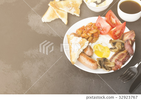 Traditional English breakfast - bacon, sausages Traditional English breakfast - bacon, sausages 32923767