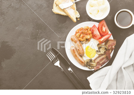 Traditional English breakfast - bacon, sausages Traditional English breakfast - bacon, sausages 32923810
