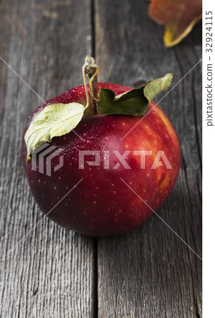Harvest of red apples on a dark wooden background Harvest of red apples on a dark wooden background 32924115